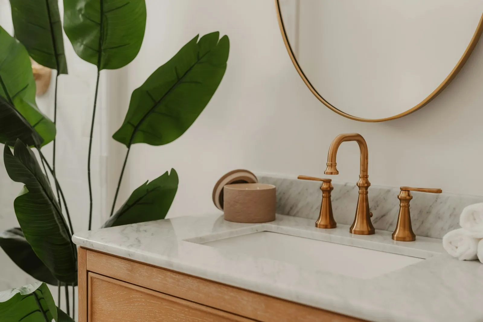 Brass basin taps on a marble vanity