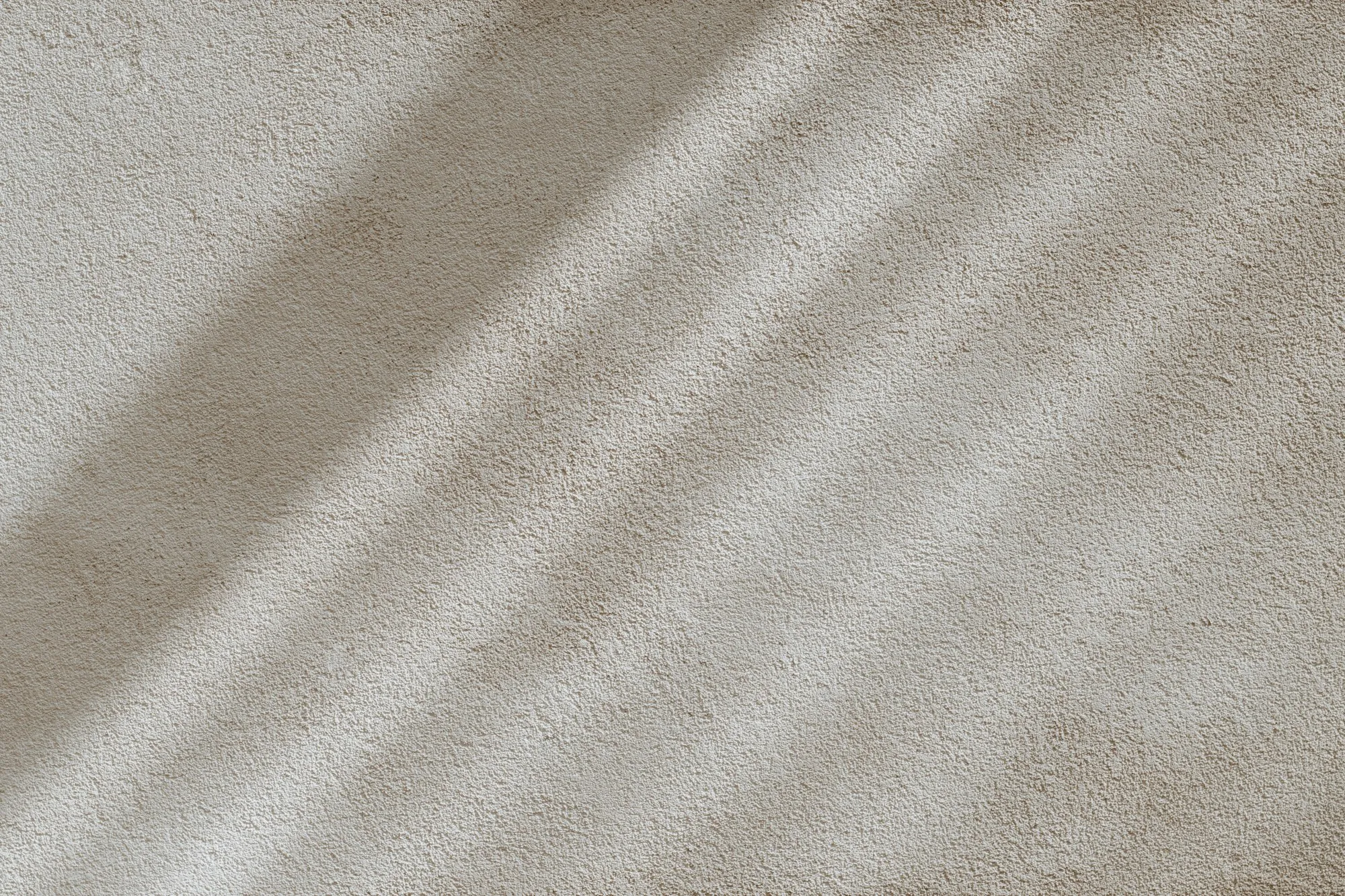 Light falling across a finished plaster wall